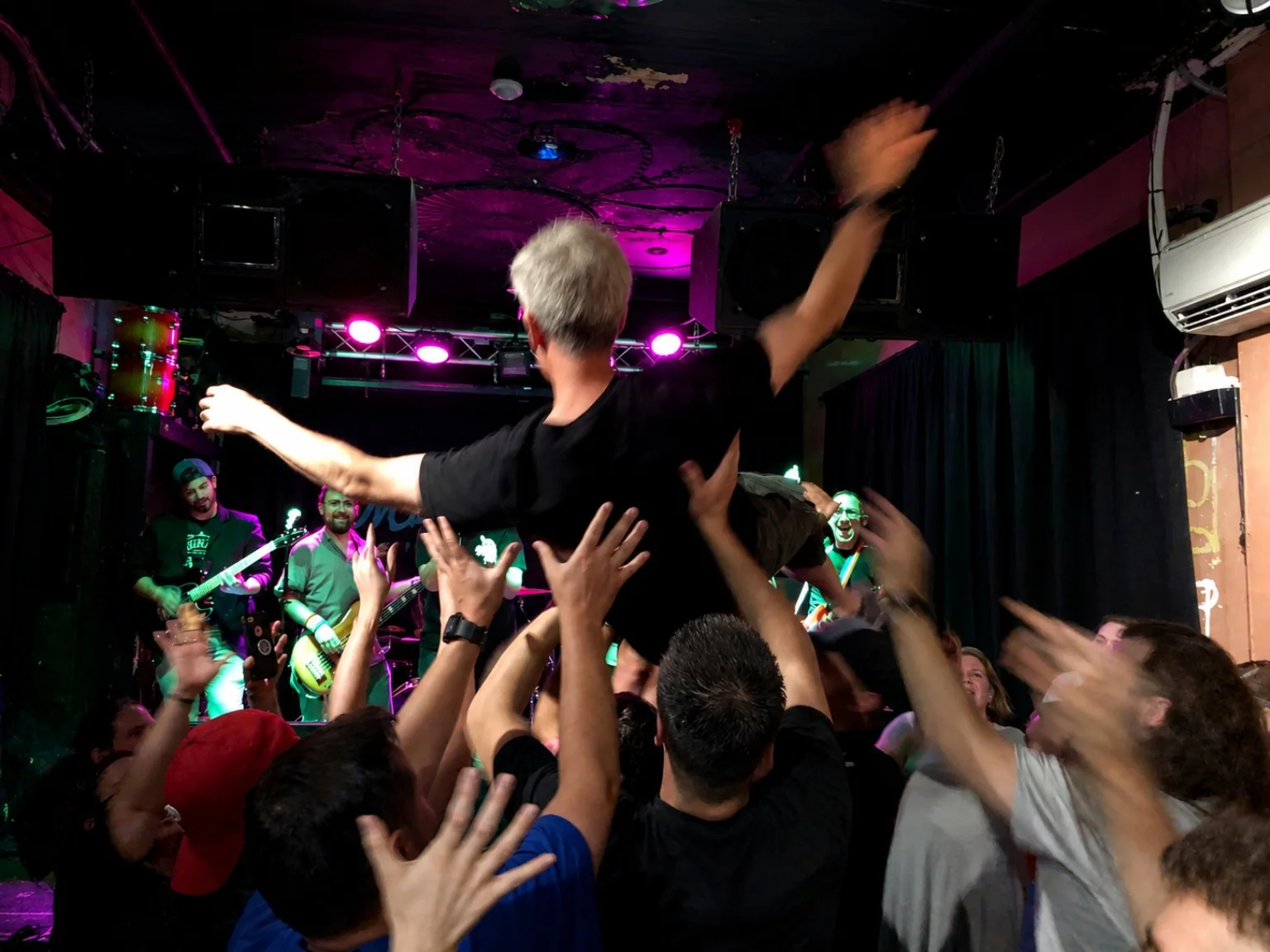 Crowd surfer above an energetic audience